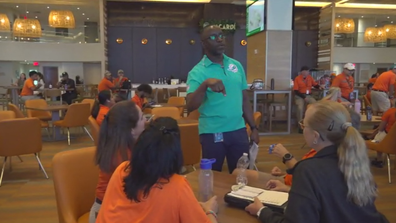 Miami Dade College professor finds his passion with side job at Hard Rock Stadium — CBS Miami, Richardson Arts news
